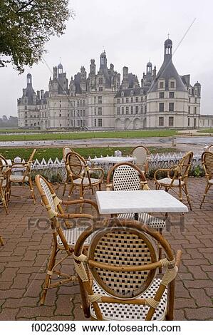 Stock Photo - France, Touraine, Chambord, restaurant terrace with castle view. Fotosearch