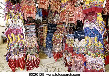 Stock Photo - Guatemala, Antigua, market, multicoloured shirts. Fotosearch