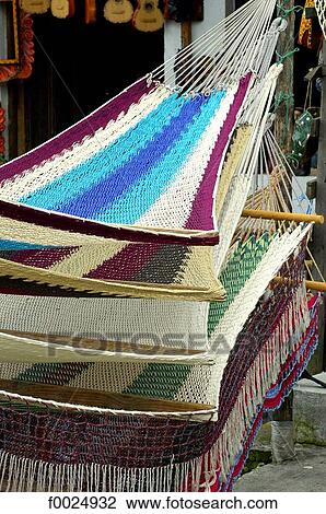 Stock Image - Guatemala, Santiago Atitlan, hammocks for sale at the market. Fotosearch