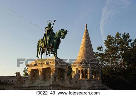 Stock Photo - Hungary, Budapest, statue of St Stephen at sunset. Fotosearch