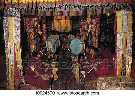 Stock Image - India, Jammu and Kashmir, Ladakh, Tikse Monastery, monks at prayer. Fotosearch