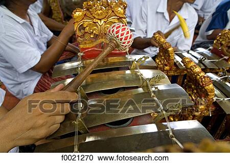 Stock Image - Indonesia, Bali, Denpensar, cremation ceremony of a brahman lady, musical instrument. Fotosearch
