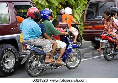 Indonesia, Bali, family on a motorbike View Large Photo Image Stock Photograph - Indonesia, Bali, family on a motorbike. Fotosearch