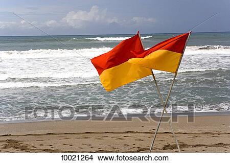 Picture - Indonesia, Bali, Seminyak, flags on the beach. Fotosearch