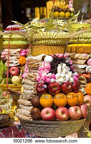 Stock Photograph - Indonesia, Bali, Sukawati, temple festival, offerings. Fotosearch