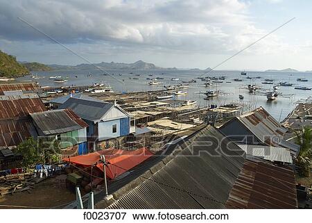 Indonesia, Flores, Lubuanbajo bay, fishermen village View Large Photo Image Stock Photo - Indonesia, Flores, Lubuanbajo bay, fishermen village. Fotosearch