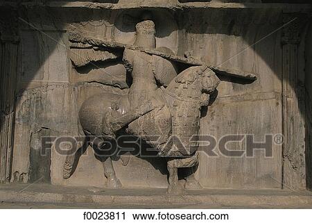 Stock Image - Iran, Kermanshah, Taq-e Bostan, Sassanid low relief in a cave. Fotosearch
