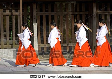 Stock Photo - Japan, Tokyo, Meiji shintoist shrine, women wearing traditional costume. Fotosearch