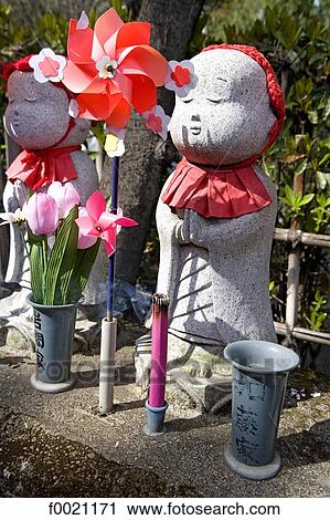 Stock Image - Japan, Tokyo, Shiba quarter, Temple of Zojoji park, steles for dead children. Fotosearch