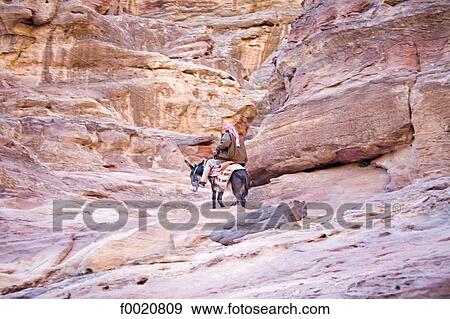 Jordan, Petra, donkey ridding in the Siq View Large Photo Image Stock Photo - Jordan, Petra, donkey ridding in the Siq. Fotosearch