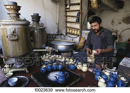 Stock Photo - Pakistan, North-West Frontier Province, Peshawar, man making teapots. Fotosearch