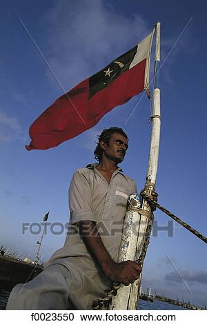 Pakistan, Sindh, Karachi, fishing port, fisherman and flag View Large Photo Image Stock Image - Pakistan, Sindh, Karachi, fishing port, fisherman and flag. Fotosearch