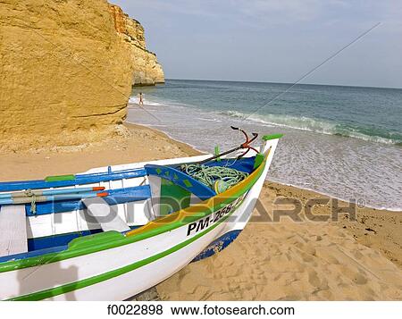Stock Photo - Portugal, Algarve, near Albufeira, beach, fishing boat. Fotosearch