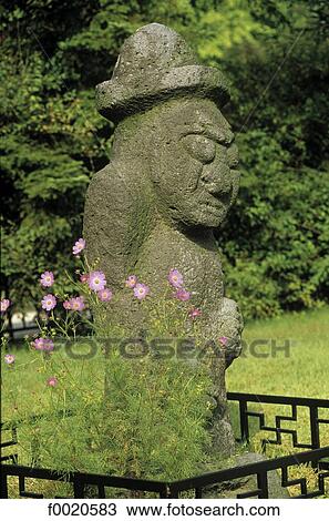 Stock Image - South Korea, Seoul, Kyongbokkung Palace, statue of Tolharubang. Fotosearch