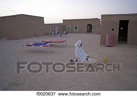 Sudan, Eastern Sahara, Soleib, evening prayer View Large Photo Image Stock Photo - Sudan, Eastern Sahara, Soleib, evening prayer. Fotosearch