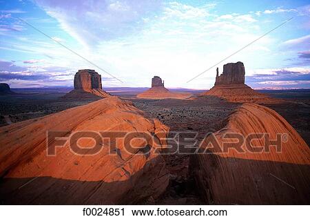 Stock Image - United States, Utah, Monument Valley, red rocks at sunset. Fotosearch