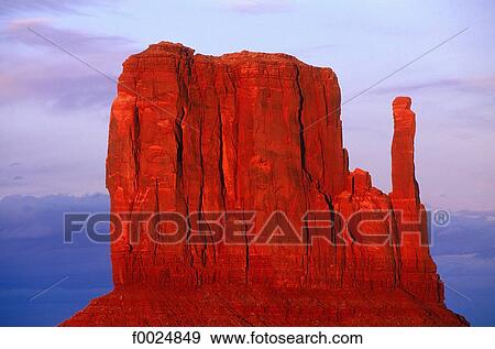 Stock Photo - United States, Utah, Monument Valley, red rocks at sunset. Fotosearch