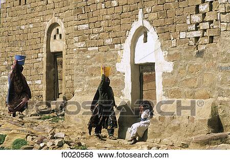 Yemen, Thula, women carrying water View Large Photo Image Stock Photo - Yemen, Thula, women carrying water. Fotosearch