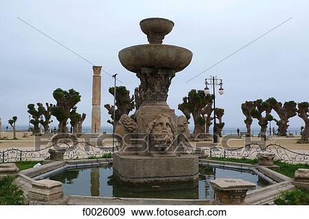 Algeria, Cherchell, Martyrs Square, Roman fountain and pillar View Large Photo Image Stock Photo - Algeria, Cherchell, Martyrs Square, Roman fountain and pillar. Fotosearch