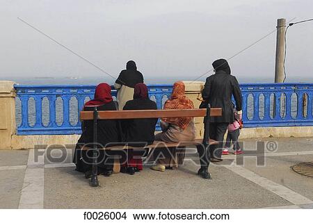 Algeria, Tipaza vicinity, veiled women facing the Mediterranean Sea View Large Photo Image Picture - Algeria, Tipaza vicinity, veiled women facing the Mediterranean Sea. Fotosearch