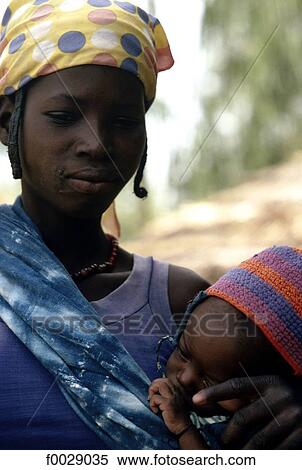 Stock Photography - Burkina Faso, Gurma country, woman and her baby. Fotosearch