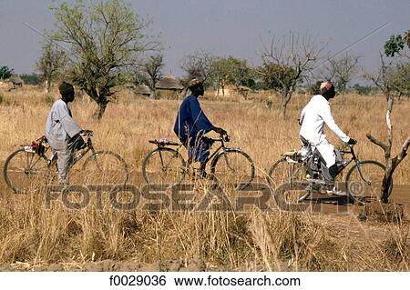Burkina Faso, near Koupela, men on bikes View Large Photo Image Stock Photograph - Burkina Faso, near Koupela, men on bikes. Fotosearch