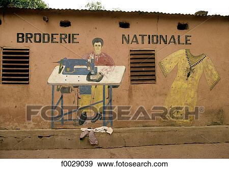 Burkina Faso, tailor shop, ad painted on a wall View Large Photo Image Stock Photo - Burkina Faso, tailor shop, ad painted on a wall. Fotosearch