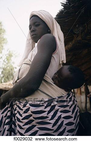 Stock Image - Burkina Faso, woman and her baby. Fotosearch