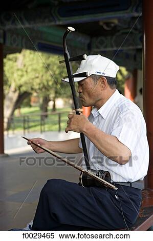China, Beijing, gardens of the Temple of Heaven, erhu player View Large Photo Image Stock Photography - China, Beijing, gardens of the Temple of Heaven, erhu player. Fotosearch