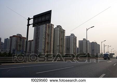 Stock Image - China, Beijing, highway and habitations buildings. Fotosearch