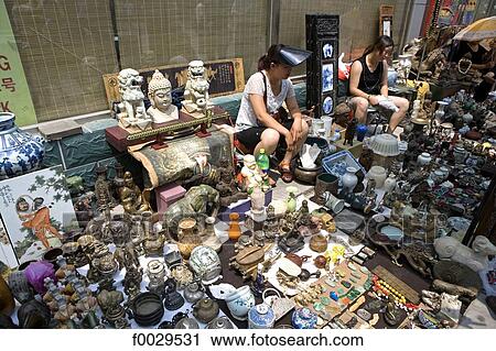 Stock Image - China, Beijing, Panjiayuan market, antiques on sale. Fotosearch