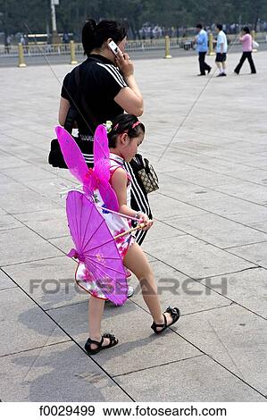 China, Beijing, Tianamen Square, little girl in butterfly costume View Large Photo Image Stock Photo - China, Beijing, Tianamen Square, little girl in butterfly costume. Fotosearch