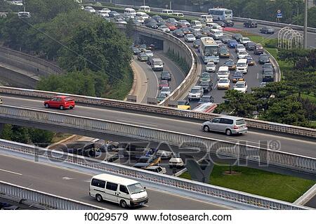 Stock Photo - China, Beijing, traffic on the highways seen from the ramparts. Fotosearch