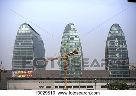 Stock Image - China, Beijing, Xizhimen station, office towers designed by a French architect. Fotosearch