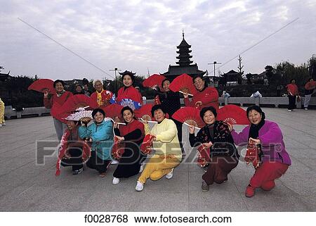 Stock Photo - China, Jiangsu, Suzhou, group of women practising the fan dance. Fotosearch