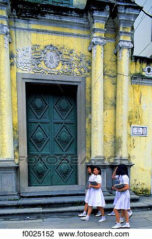 China, Macau, schoolgirls passing in front of a Portuguese church View Large Photo Image Stock Image - China, Macau, schoolgirls passing in front of a Portuguese church. Fotosearch
