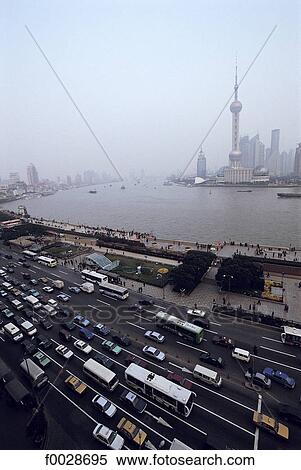 Stock Photography - China, Shanghai, the Bund promenade, Huangpu River and new town of Pudong. Fotosearch