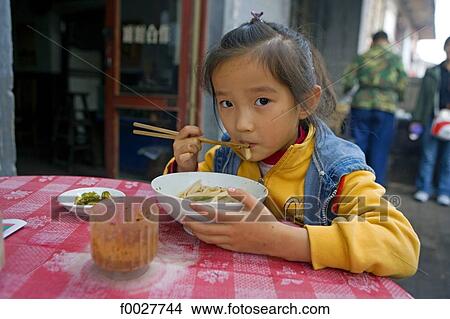 China, Shanxi province, Pingyao, Chinese young girl View Large Photo Image Picture - China, Shanxi province, Pingyao, Chinese young girl. Fotosearch