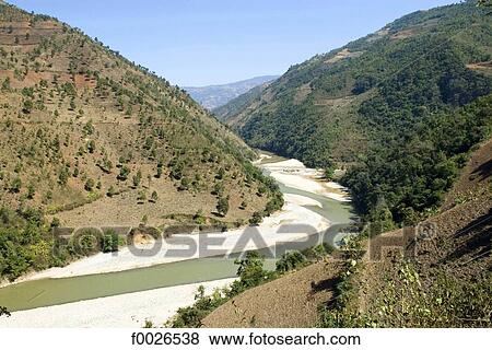 Stock Photo - China, Yunnan, between Lancang and Shuangliang, river and mountains. Fotosearch
