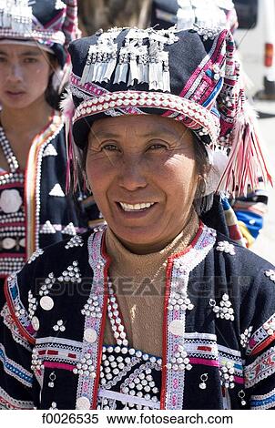 China, Yunnan, Lancang, Aini woman wearing traditional costume View Large Photo Image Stock Photography - China, Yunnan, Lancang, Aini woman wearing traditional costume. Fotosearch