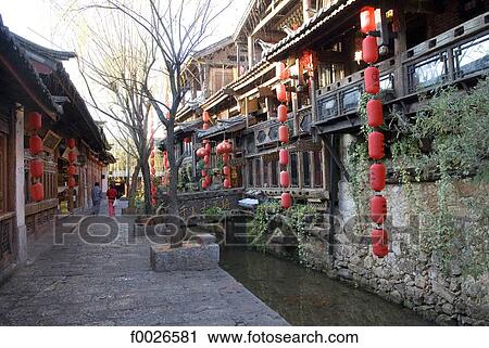 China, Yunnan, Lijiang, souvenir shops along a canal View Large Photo Image Stock Image - China, Yunnan, Lijiang, souvenir shops along a canal. Fotosearch