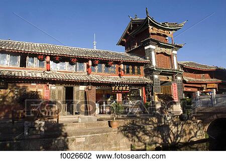 China, Yunnan, Lijiang, souvenir shops along a canal View Large Photo Image Stock Image - China, Yunnan, Lijiang, souvenir shops along a canal. Fotosearch