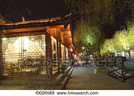 China, Yunnan, Lijiang, souvenir shops along a canal View Large Photo Image Stock Photo - China, Yunnan, Lijiang, souvenir shops along a canal. Fotosearch