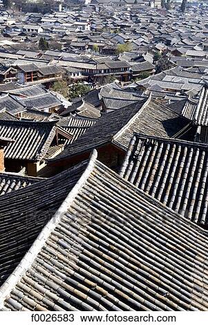 Stock Image - China, Yunnan, Lijiang, view of roofs. Fotosearch