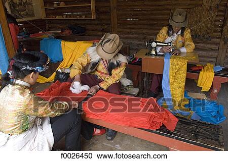 China, Yunnan, near Kunming, Yunnan Nationalities Village, traditional costume making View Large Photo Image Stock Image - China, Yunnan, near Kunming, Yunnan Nationalities Village, traditional costume making. Fotosearch