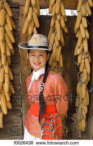 Stock Photo - China, Yunnan, near Kunming, Yunnan Nationalities Village, young Naxi woman. Fotosearch