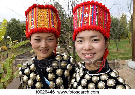 China, Yunnan, near Kunming, Yunnan Nationalities Village, young Jingpo women View Large Photo Image Stock Photograph - China, Yunnan, near Kunming, Yunnan Nationalities Village, young Jingpo women. Fotosearch