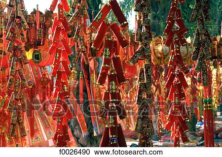 Stock Image - China, Yunnan, Xishuangbanna, Jinghong, Chinese lucky charms for sale. Fotosearch