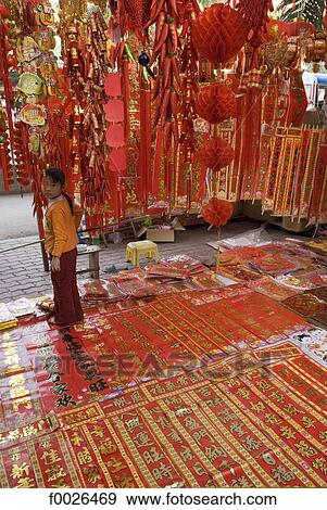 Stock Photo - China, Yunnan, Xishuangbanna, Jinghong, Chinese lucky charms for sale. Fotosearch