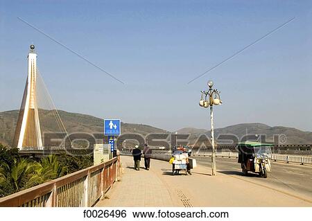 China, Yunnan, Xishuangbanna, Jinghong, bridge View Large Photo Image Stock Photograph - China, Yunnan, Xishuangbanna, Jinghong, bridge. Fotosearch